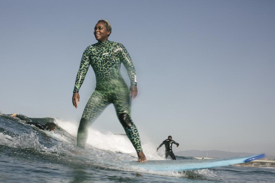 Marina Del Rey, CA - Saturday, March 13 Jameelah Booker paddles for a wave during a morning surf session.