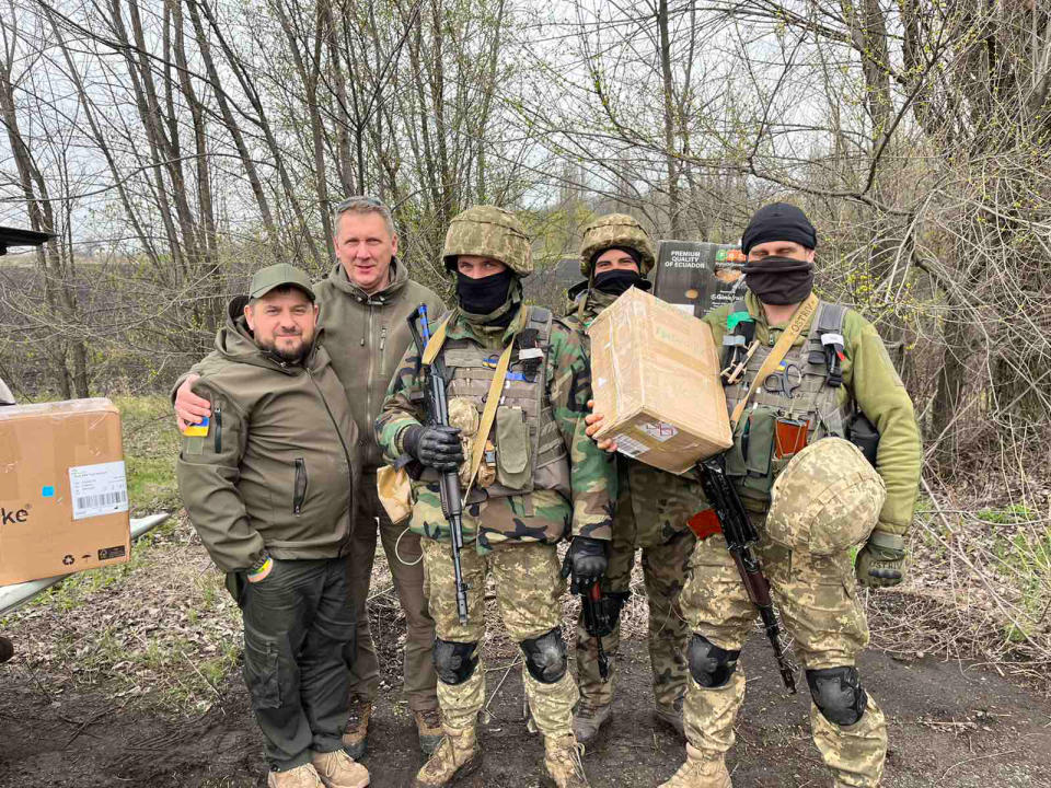 Ihor with Vitali, another volunteer, and three unidentified soldiers outside Kryvyi Rih - Credit: Danny Gold