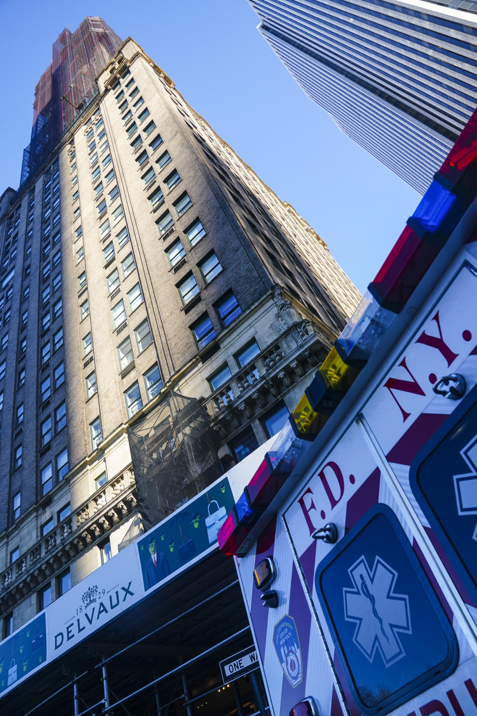 A fire department vehicle standby outside the Sherry Netherland hotel, center, after an earlier fire on the same floor as the penthouse residence of Chinese businessman Guo Wengui, who has been arrested on charges alleging that he oversaw a $1 billion fraud conspiracy, Wednesday March 15, 2023, in New York. (AP Photo/Bebeto Matthews)