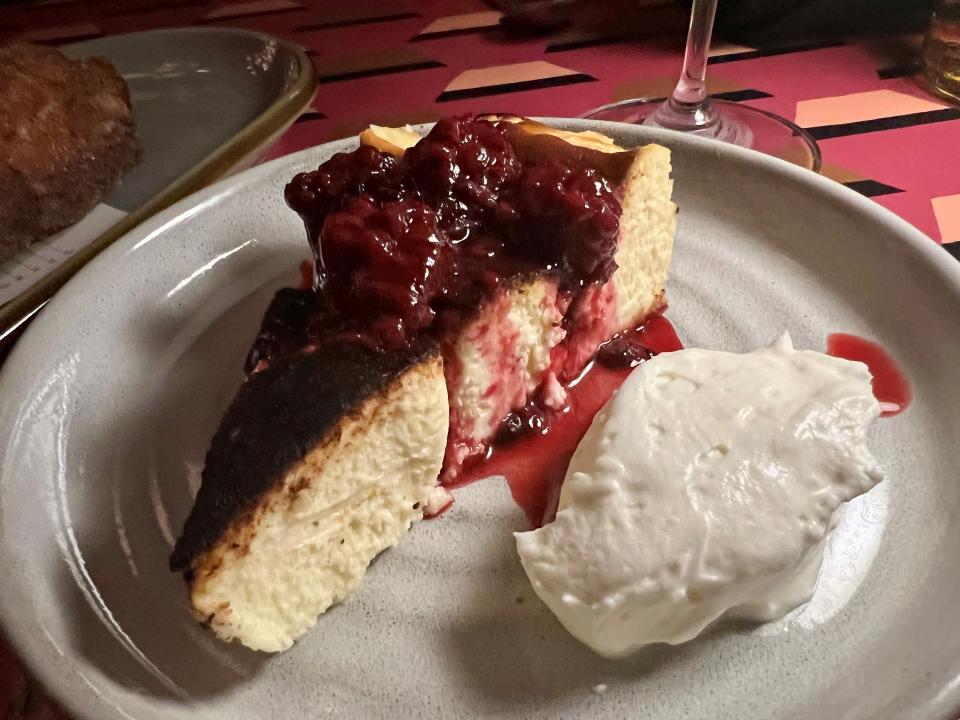 The Basque cheesecake with drunken berry compote and chantilly at The Iberian Pig in the Gulch in Nashville on Oct. 24, 2023