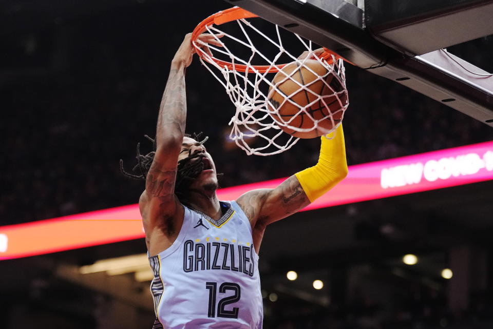 Memphis Grizzlies guard Ja Morant dunks against the Toronto Raptors during the first half of an NBA basketball game Thursday, Dec. 29, 2022, in Toronto. (Frank Gunn/The Canadian Press via AP)