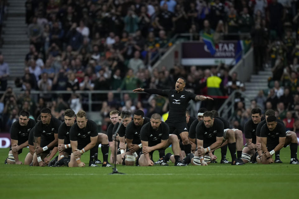 New Zealand's Aaron Smith leads teammates as they perform the Haka before the rugby union international match between South Africa and New Zealand, at Twickenham stadium in London, Friday, Aug. 25, 2023. (AP Photo/Alastair Grant)