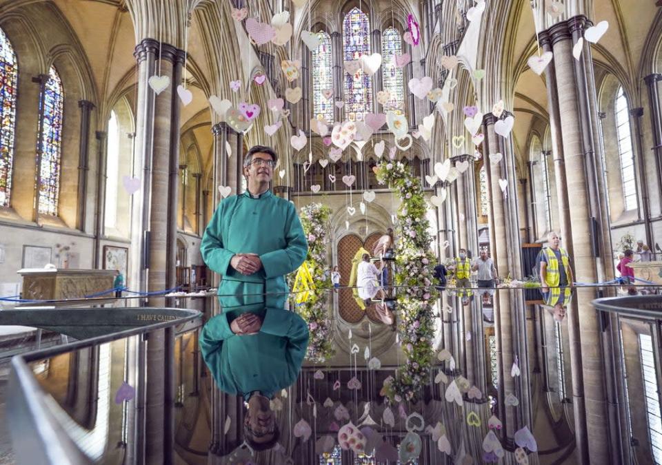 The Dean of Salisbury Cathedral Nick Papadopulos looks at the exhibits (Steve Parsons/PA) (PA Wire)