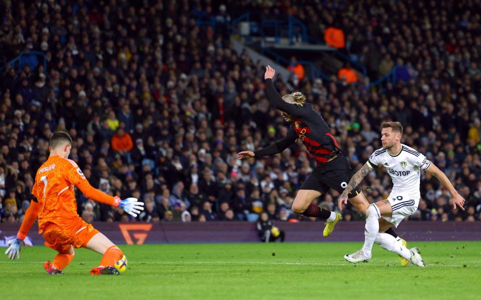 Leeds United's Illan Meslier saves a shot from Manchester City's Erling Braut Haaland - REUTERS