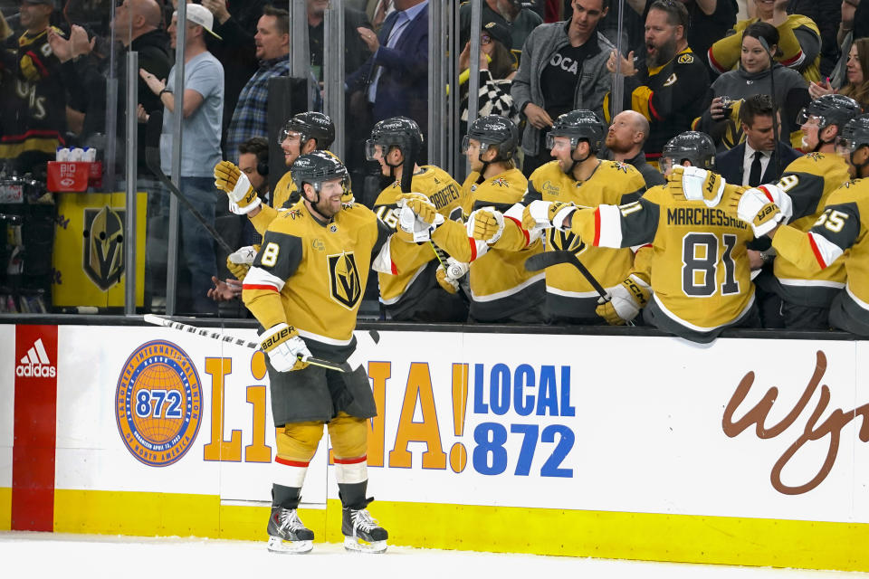 Vegas Golden Knights center Phil Kessel (8) is congratulated by teammates after scoring a goal against the Los Angeles Kings during the first period of an NHL hockey game Thursday, April 6, 2023, in Las Vegas. (AP Photo/Lucas Peltier)