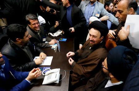 Hassan Khomeini (2nd R), 43, a grandson of Iran's Ayatollah Ruhollah Khomeini, registers for February's election of the Assembly of Experts, the clerical body that chooses the supreme leader, at the Interior Ministry in Tehran December 18, 2015. REUTERS/TIMA