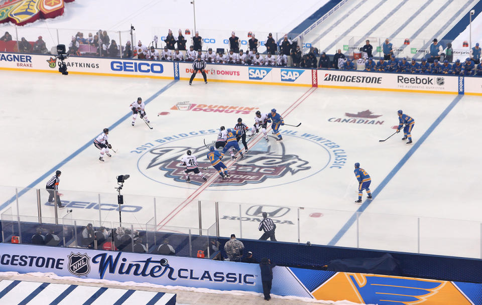 <p>ST LOUIS, MO – JANUARY 02: Jonathan Toews #19 of the Chicago Blackhawks and Jori Lehtera #12 of the St. Louis Blues take the opeing faceo-off in the first period of the 2017 Bridgestone NHL Winter Classic at Busch Stadium on January 2, 2017 in St Louis, Missouri. (Photo by Jared Silber/NHLI via Getty Images) </p>