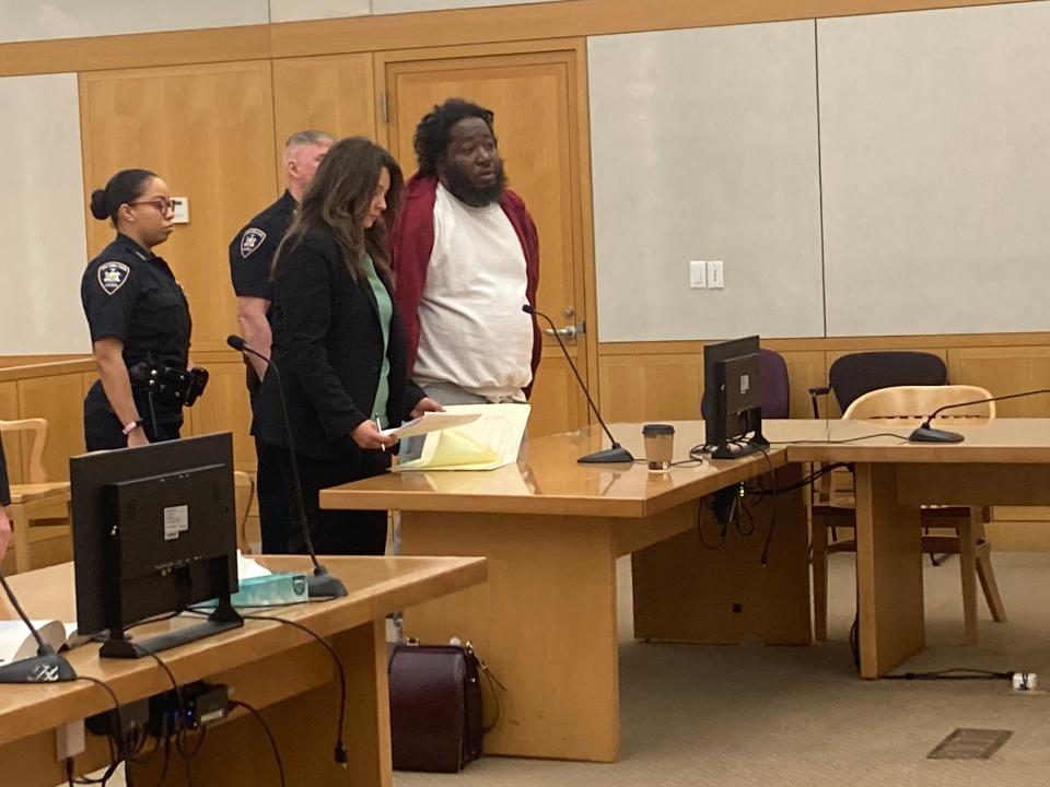 Phillip Ferrell with his lawyer Courtney McGowan at his arraignment in Westchester County Court on April 19, 2024, A new indictment upgrades to second-degree murder the charges against Ferrell in connection to the March 9, 2023, shooting death of 14-year-old Zyaire Fernandez in Mount Vernon.