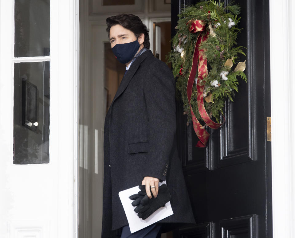 Canadian Prime Minister Justin Trudeau closes the door as he steps out of Rideau cottage for a bi-weekly news conference on the Covid-19 pandemic in Ottawa, Ontario, Friday, Nov. 27, 2020. (Adrian Wyld/The Canadian Press via AP)