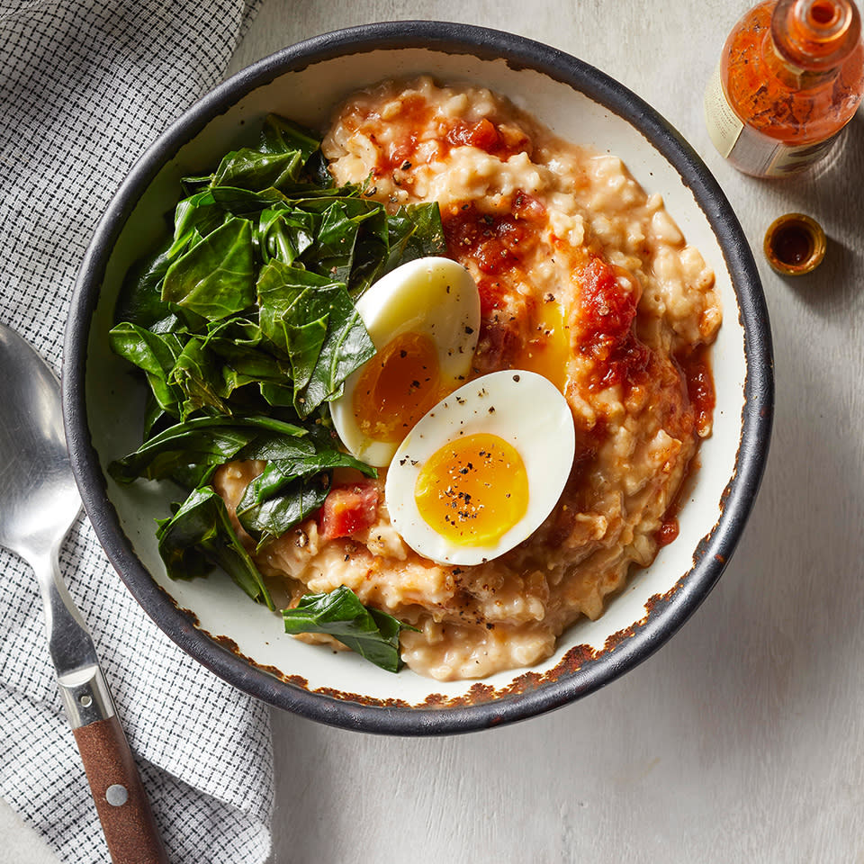 <p>Have you tried savory oats yet? It's a nice change-up from the sweet way oatmeal is typically served, plus you get a full serving of vegetables. Serve with hot sauce, if desired.</p> <p> <a href="https://www.eatingwell.com/recipe/267654/savory-oatmeal-with-cheddar-collards-eggs/" rel="nofollow noopener" target="_blank" data-ylk="slk:View Recipe;elm:context_link;itc:0;sec:content-canvas" class="link ">View Recipe</a></p>