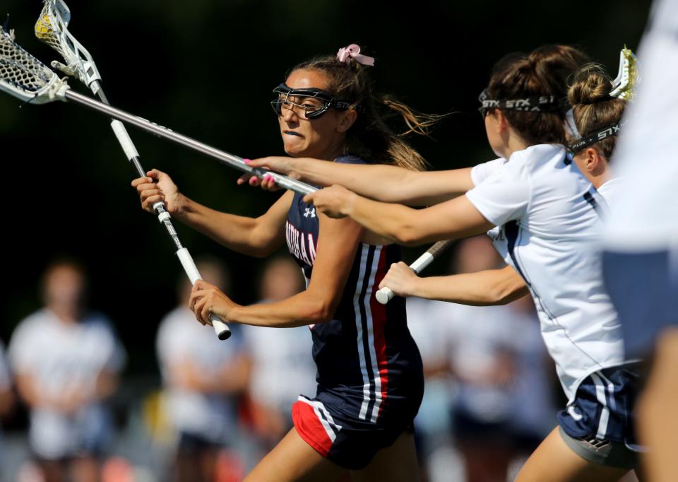 Sophia Cardella of Mendham, tries to escape the Chatham defense. Thursday, June 10, 2021