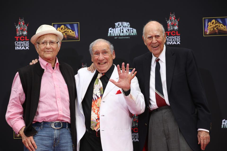 In this Monday, Sept. 8, 2014 photo, from left, Writer/Producer, Norman Lear, Director/Comedian Mel Brooks and Director/Actor Carl Reiner stand together during Brooks' Hand and Footprint ceremony on the 40th anniversary of the movie "Young Frankenstein," in front of the TCL Chinese Theatre in Hollywood section of Los Angeles. (AP Photo/Nick Ut) ORG XMIT: CAET746