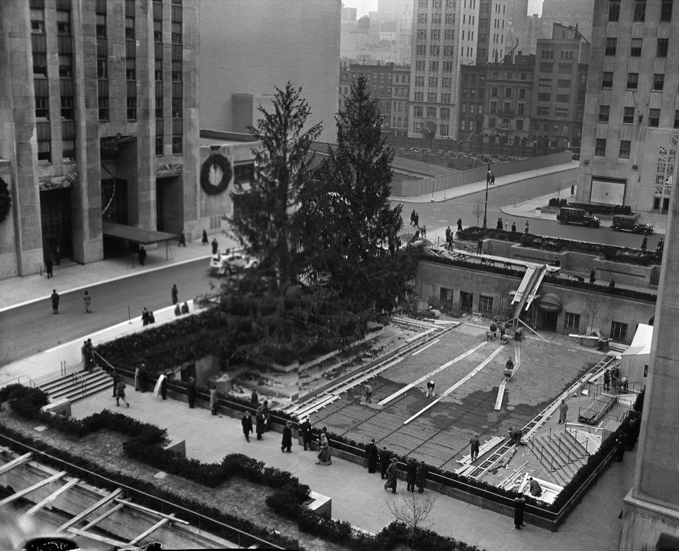 The ice skating rink at Rockefeller Center is under construction, Dec. 19, 1936. The rink is about 50 feet by 100 feet and will be ready for use by Christmas day. Admission will be $1. (AP Photo)