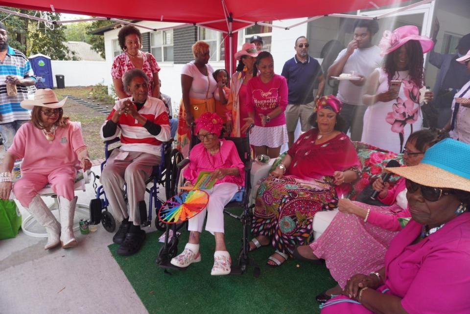 Magnolia Jackson, third from left front in wheelchair, celebrated her 106th birthday at her home in east Gainesville.
(Credit: Photo by Voleer Thomas, Correspondent)
