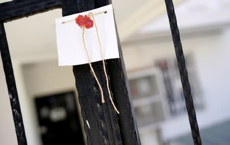 The seal is seen on a gate of a girls dormitory which was sealed by Turkish authorities over alleged links to the followers of U.S. based cleric Fethullah Gulen, who Turkey accused of staging a coup attempt in July, in Ankara, Turkey, August 16, 2016. REUTERS/Umit Bektas