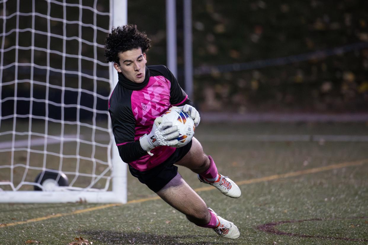 Westport keeper Noah Amaral makes a diving save versus Douglas in the D5 state soccer final on Saturday November 18, 2023 at Doyle Field in Leominster.