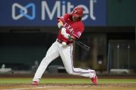 Texas Rangers' Jonah Heim hits an RBI single against the Seattle Mariners during the sixth inning of a baseball game in Arlington, Texas, Friday, Aug. 12, 2022. (AP Photo/Tony Gutierrez)