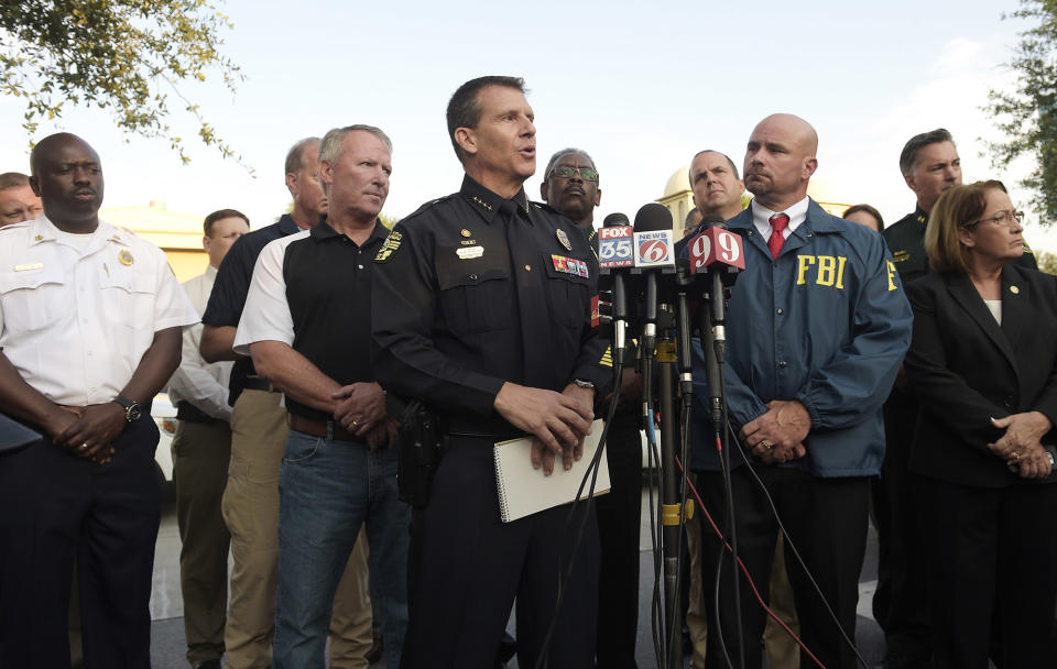 <p>Orlando Police Chief John Mina, center, addresses reporters during a news conference after a shooting involving multiple fatalities at a nightclub in Orlando, Fla., Sunday, June 12, 2016. (AP Photo/Phelan M. Ebenhack) </p>