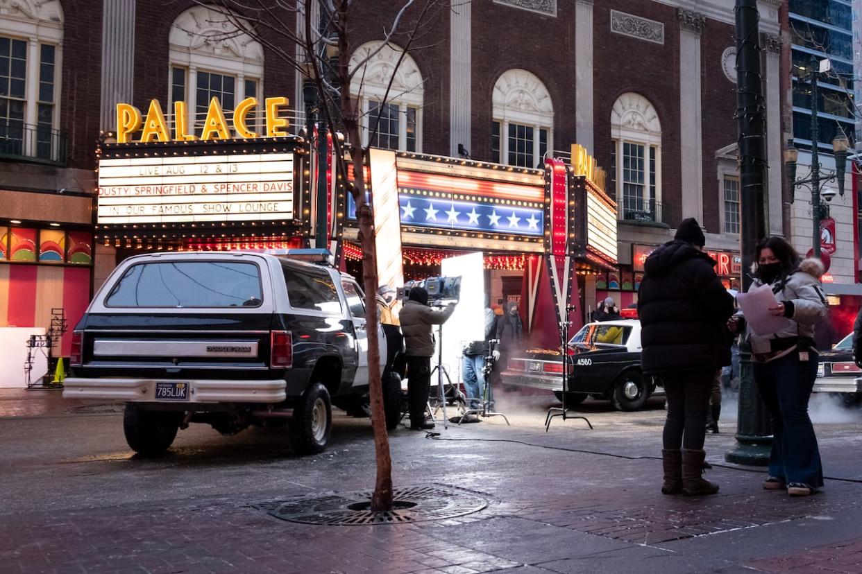 Photos from the set of the FX miniseries Under The Banner of Heaven, taken outside the Palace Theatre on Stephen Avenue in Downtown Calgary on Dec. 14. Strikes in the U.S. have caused many local productions to shut down.  (Ose Irete/CBC - image credit)