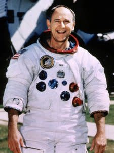 FILE PHOTO: Retired Astronaut Alan Bean, 66, poses for a portrait in his spacesuit at the Johnson Space Center in Houston, Texas, U.S., in this undated photo. Bean, who was the fourth man to walk on the moon in 1969, left NASA in 1981 and made a successful transition from spaceman to a full-time professional artist.  REUTERS/Stringer/File Photo