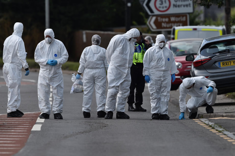 Police search the scene, where Thames Valley Police officer Pc Andrew Harper, 28, died following a "serious incident" at about 11.30pm on Thursday near the A4 Bath Road, between Reading and Newbury, at the village of Sulhamstead in Berkshire.