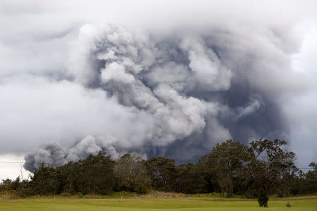 Ash erupts from the Halemaumau crater near the community of Volcano during ongoing eruptions of the Kilauea Volcano in Hawaii, U.S., May 15, 2018. REUTERS/Terray Sylvester