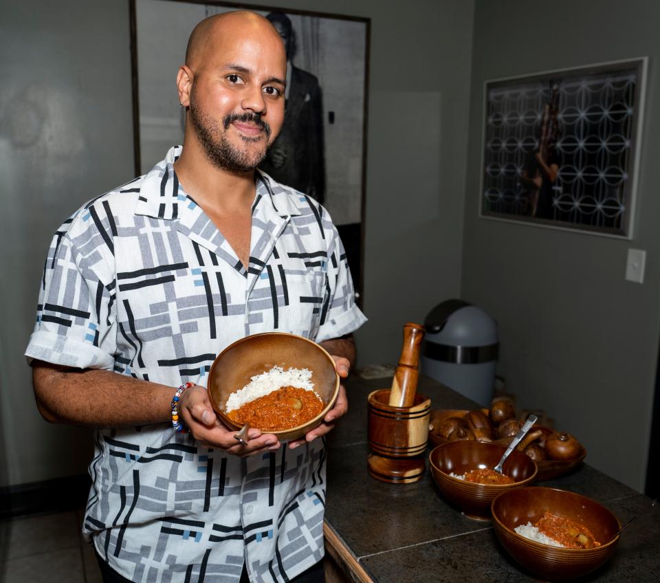 CK Ledesma shows off a bowl of conbif, Puerto Rican corned beef hash, on June 23, 2023 in Milwaukee. The dish was part of their 2020 project Proyecto Conbif.