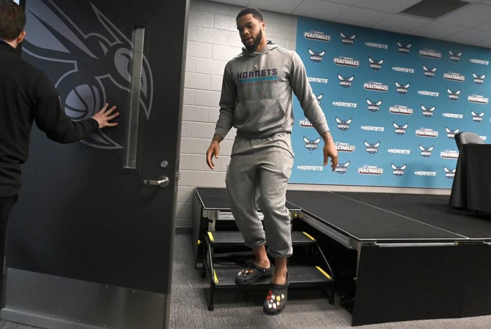 Charlotte Hornets forward Miles Bridges, right, exits the interview room after answering questions from the local media on Monday, April 15, 2024.