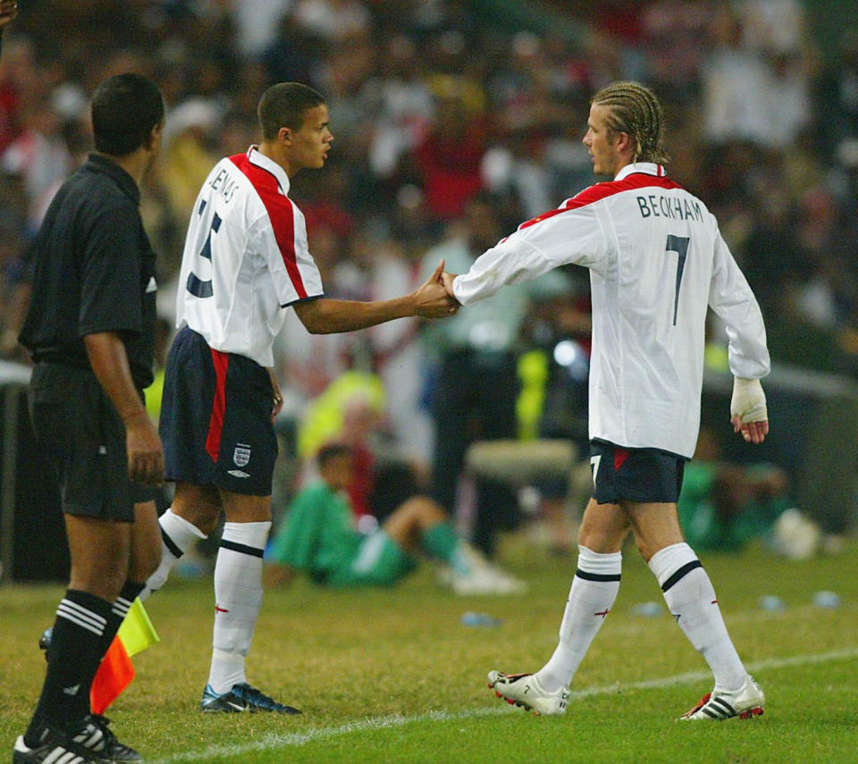 DURBAN, SOUTH AFRICA - MAY 22: England Captain David Beckham comes off the pitch injured and shakes hands with Jermaine Jenas during the international friendly football match played between South Africa and England at The ABSA Stadium May 22, 2003 in Durban, South Africa. (Photo by Ben Radford/Getty Images)
