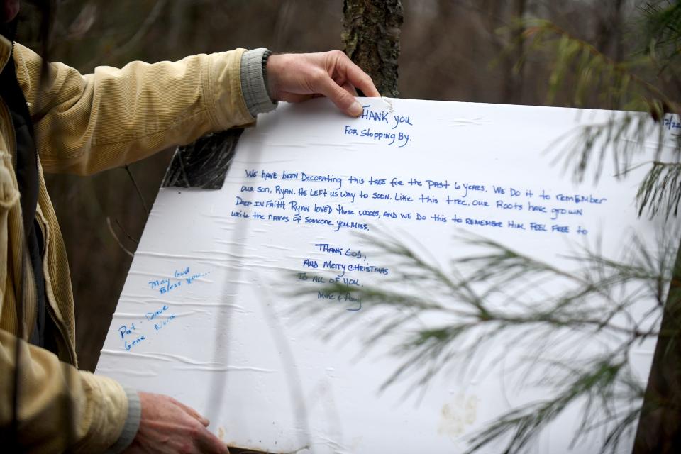 Each year, Michael and Amy Catlin Wozniak display a poster board sign near the R.Y.A.N. Tree at Quail Hollow Park to honor the  memory of Ryan Wozniak. People can write messages about those they've lost.