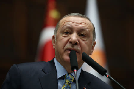 FILE PHOTO: Turkish President Tayyip Erdogan addresses members of parliament from his ruling AK Party (AKP) during a meeting at the Turkish parliament in Ankara, Turkey, January 15, 2019. REUTERS/Umit Bektas