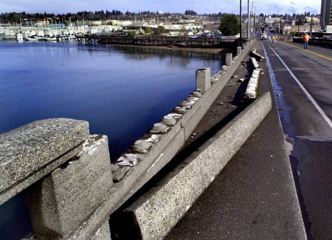 Staff file, 2001: Damage to the Fourth Avenue Bridge in Olympia is evident as workers assess the impact of the Nisqually Earthquake.