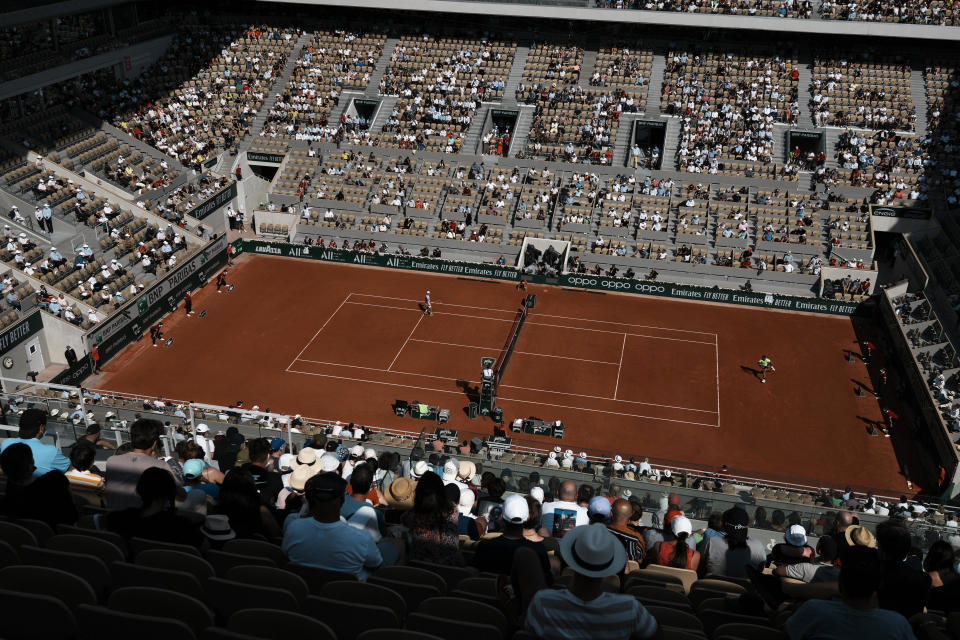 The crowd watch Spain's Rafael Nadal playing Argentina's Diego Schwartzman during their quarterfinal match of the French Open tennis tournament at the Roland Garros stadium Wednesday, June 9, 2021 in Paris. (AP Photo/Thibault Camus)