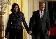 U.S. President Barack Obama arrives with First lady Michelle Obama to welcome U.S. Olympic and Paralympics teams at the White House in Washington, U.S., September 29, 2016. REUTERS/Yuri Gripas