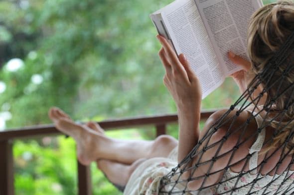 woman lying in a hammock in a...