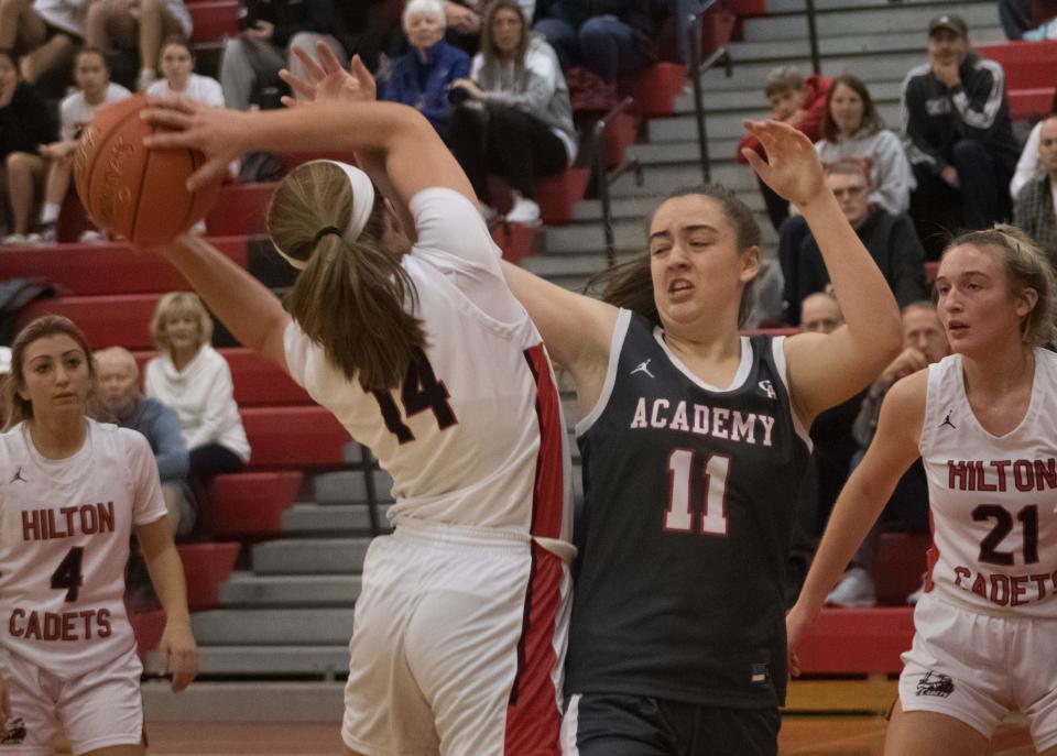 Hilton's Mallory Heise takes the ball from Canandaigua's Kyleigh Chapman.