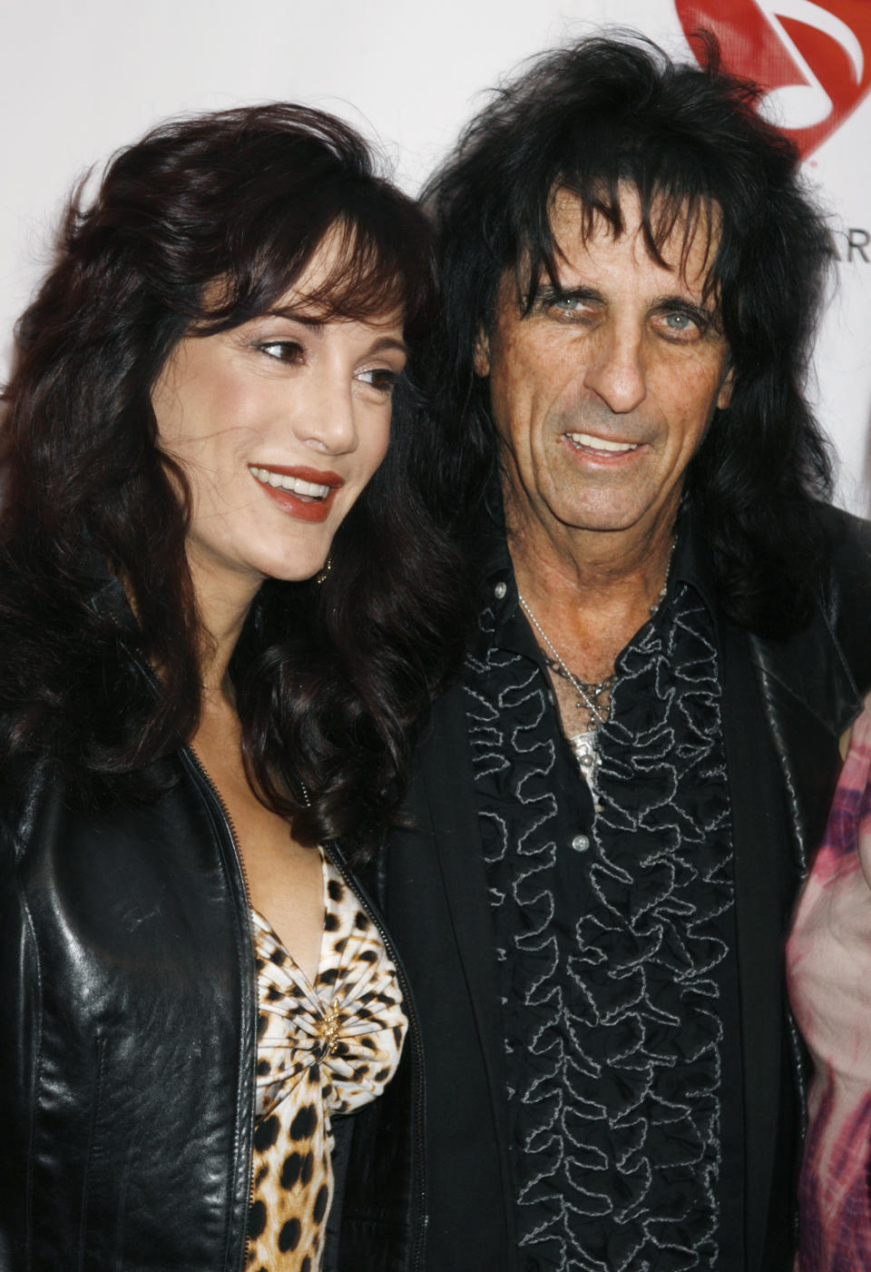 Rock star Alice Cooper (R) poses with wife Sheryl as they arrive at the MusiCares MAP Fund benefit concert in Hollywood, California May 9, 2008. Cooper was honored with the Stevie Ray Vaughan Award for his support of MusiCares which provides access to addiction recovery treatment for members of the music community at the concert.  REUTERS/Fred Prouser                (UNITED STATES)