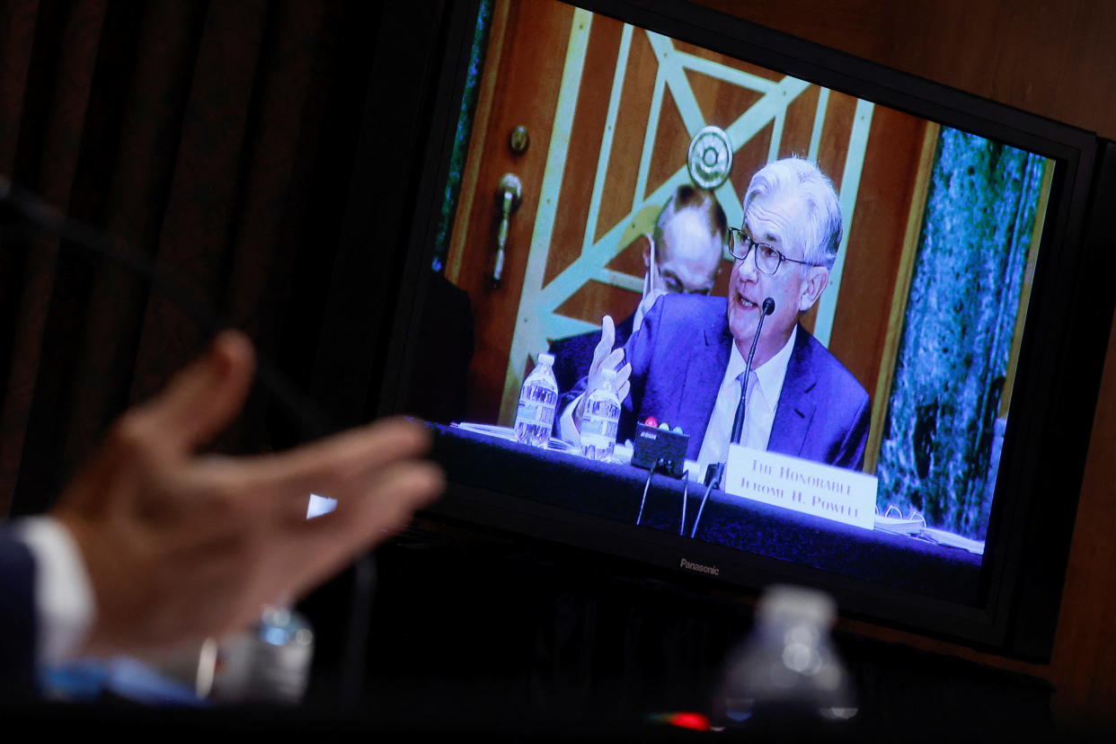 U.S. Federal Reserve Chair Jerome Powell is seen on a video screen as he testifies before a Senate Banking, Housing, and Urban Affairs Committee hearing on the Fed&#39;s 