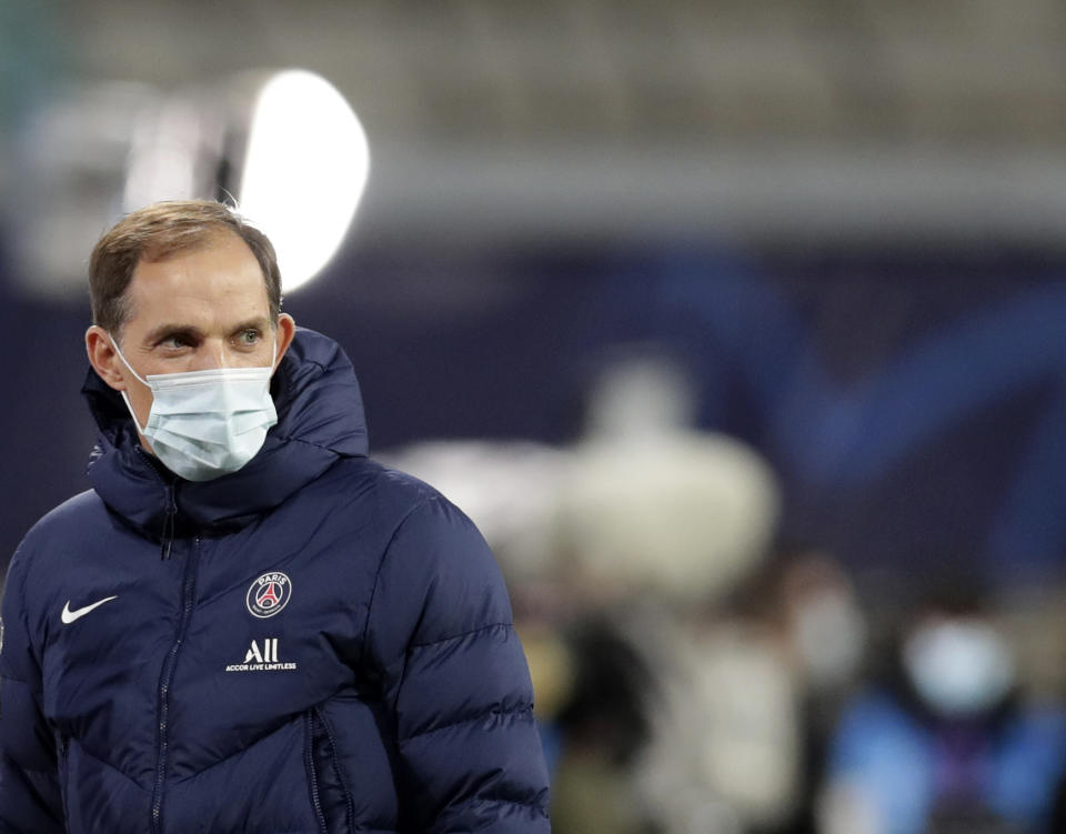 FILE - In this file photo dated Wednesday, Nov. 4, 2020, PSG's head coach Thomas Tuchel looks on during warm up before the Champions League group H soccer match against RB Leipzig at the RB Arena in Leipzig, Germany. Thomas Tuchel is confirmed as the new Chelsea soccer team manager, Tuesday Jan. 26, 2021.(AP Photo/Michael Sohn, FILE)