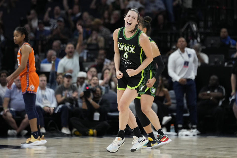 Minnesota Lynx forward Bridget Carleton (6) celebrates after making a 3-point basket against the Conneticut Sun during the first half of Game 3 of a WNBA first-round basketball playoff series Wednesday, Sept. 20, 2023, in Minneapolis. (AP Photo/Abbie Parr)