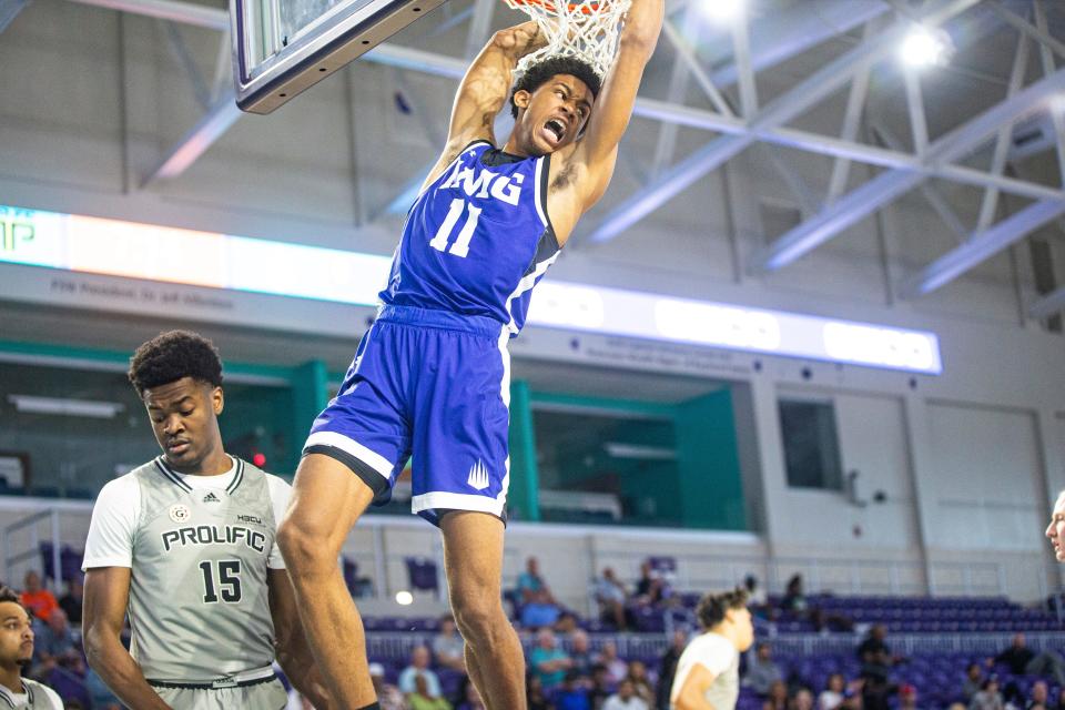 Khani Rooths of IMG Academy dunks  against Prolific Prep in GEICO High School Nationals quarterfinal game ay Suncoast Credit Union Arena on Thursday. IMG won. 