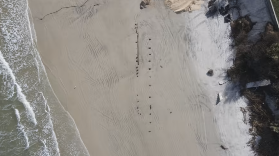 The object began protruding out of the sand after Hurricanes Ian and Nicole battered Volusia County earlier this year, said Kevin A. Captain, director of information for Volusia County government.  / Credit: Volusia Beach Safety