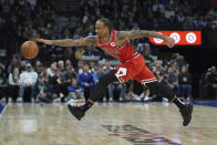 Chicago Bulls forward DeMar DeRozan reaches for the ball during the first half of an NBA basketball game against the Minnesota Timberwolves, Sunday, March 31, 2024, in Minneapolis. (AP Photo/Abbie Parr)