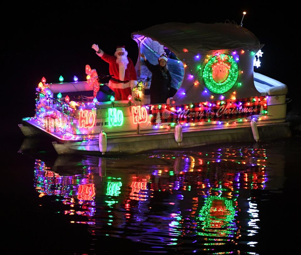 Dec 17, 2022; Tuscaloosa, AL, USA; The Pirates of the Warrior parade illuminated boats on the Black Warrior River in Tuscaloosa during the annual Christmas Afloat event.