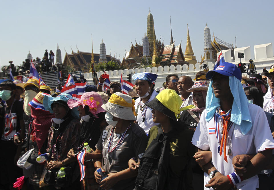 Anti-government protesters take part in a rally in front of Grand Palace Wednesday, Jan. 15, 2014, in Bangkok, Thailand. Gunshots rang out in the heart of Thailand's capital overnight in an apparent attack on anti-government protesters early Wednesday that wounded at least two people and ratcheted up tensions in Thailand's deepening political crisis.(AP Photo/Sakchai Lalit)