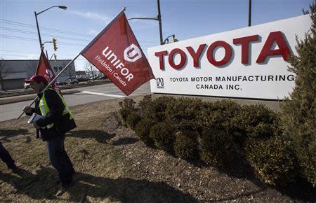 Representatives from Unifor stand outside the Toyota plant in Cambridge, March 31, 2014. REUTERS/Mark Blinch