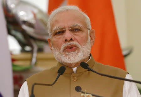 FILE PHOTO: India's Prime Minister Narendra Modi attends a presentation of a joint statement with Russian President Vladimir Putin after their delegation level talks at Hyderabad House in New Delhi, India, October 5, 2018. REUTERS/Adnan Abidi/File Photo