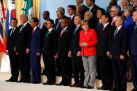 <p>French President Emmanuel Macron, U.S. President Donald Trump, Indonesia’s President Joko Widodo, Mexico’s President Enrique Pena Nieto, South African President Jacob Zuma, Argentina’s President Mauricio Macri, German Chancellor Angela Merkel, Chinese President Xi Jinping, Russian President Vladimir Putin, Turkish President Recep Tayyip Erdogan, Britain’s Prime Minister Theresa May, Australian Prime Minister Malcolm Turnbull, Japanese Prime Minister Shinzo Abe, India’s Prime Minister Narendra Modi, Canadian Prime Minister Justin Trudeau, Italian Prime Minister Paolo Gentiloni and other leaders pose for a family photo at the G20 leaders summit in Hamburg, Germany July 7, 2017. (Photo: Wolfgang Rattay/Reuters) </p>