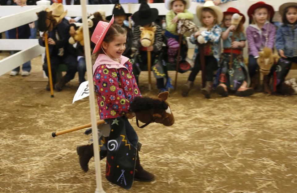 Pennington competes in the stick horse rodeo competition at the 108th National Western Stock Show in Denver