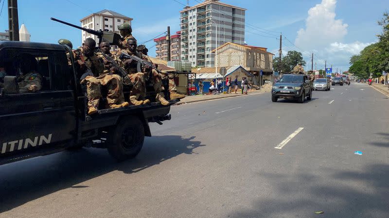 Guinean security forces patrol on the streets after armed men spring Guinea's ex-junta leader Moussa Dadis Camara out of prison in Conakry